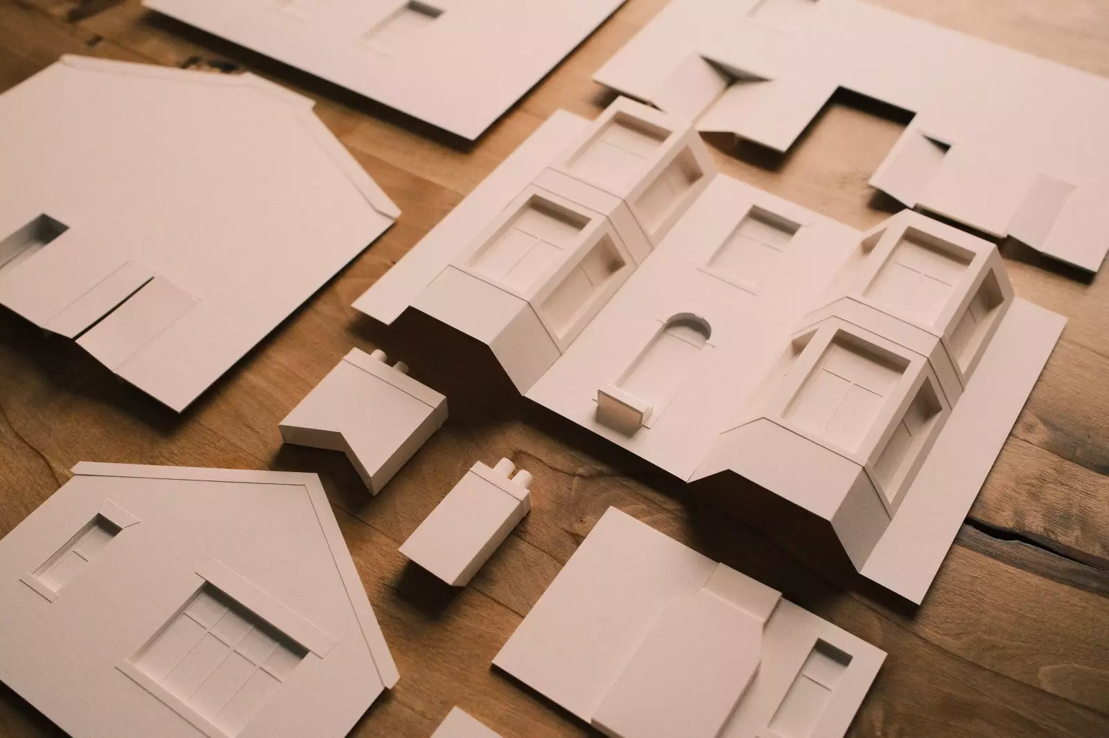 Components for a 1:50 paper model ready to be assembled for Joe & Co Architects